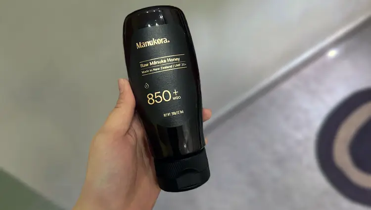 squeeze bottle of MGO 850+ manukora honey
